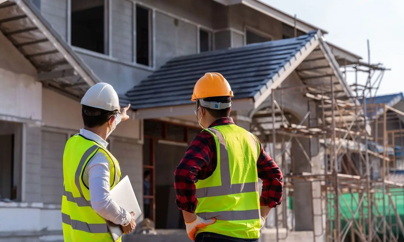 Inspector reviewing a home exterior