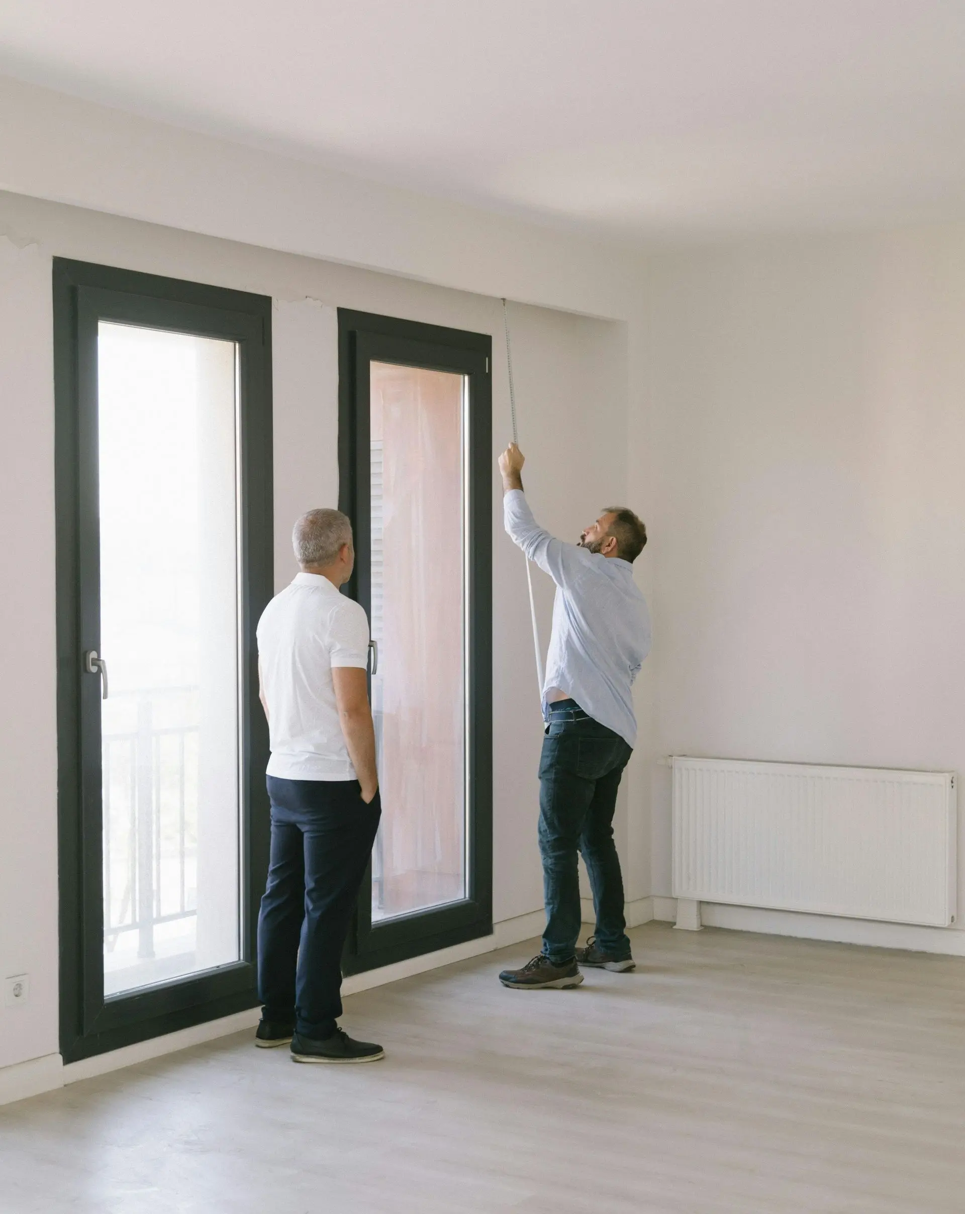 Two Fisher Home Inspections professionals inspecting a property